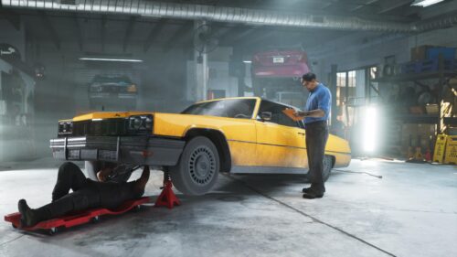 Mechanics Working on a Vintage Yellow Classic Car in Garage PC Wallpaper