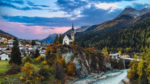 Breathtaking Swiss Alps Village Church at Sunset 4K Wallpaper