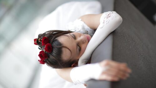 Beautiful Bride Resting with Red Roses in Hair Desktop Wallpaper