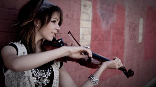 Beautiful Young Woman Playing Violin Against Red Brick Wall Desktop Wallpaper