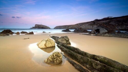 Serene Beach Sunset with Photographer Desktop Wallpaper