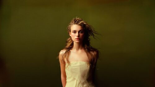 Elegant Portrait of Keira Knightley in a Light Yellow Dress PC Wallpaper