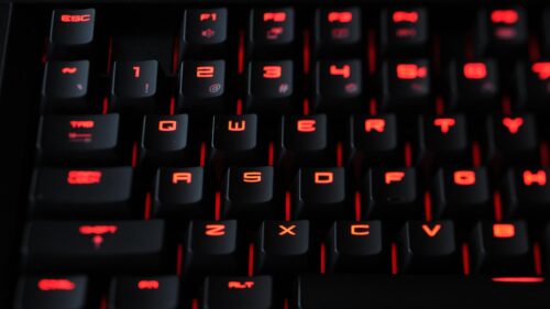 Macro Shot of Mechanical Gaming Keyboard with Red Backlit Keys PC Wallpaper