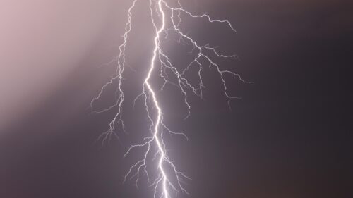 Stunning Electric Lightning Bolt Across Dark Night Sky 4K Wallpaper