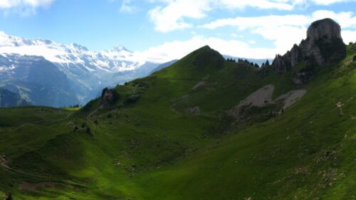 Breathtaking Alpine Mountain Landscape with Lush Green Valleys and Snow Peaks 4K Wallpaper