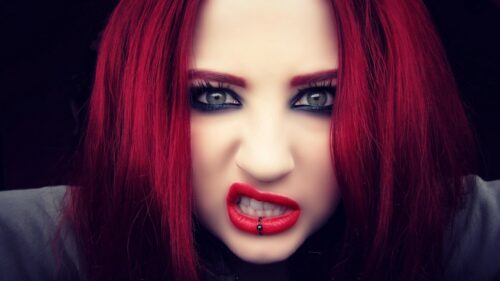 Edgy Portrait of Woman with Intense Red Hair and Piercing 4K PC Wallpaper