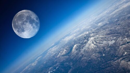 Stunning Aerial View of Earth with a Giant Moon Horizon 4K Wallpaper