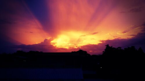Stunning Golden Hour Sunset Over Silhouetted Landscape PC Wallpaper