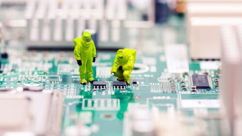 Miniature Technicians Repairing Circuit Board Desktop Wallpaper