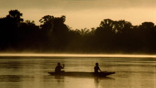 Silhouetted Fishermen on a Misty River at Golden Hour PC Wallpaper