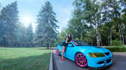 Beautiful Woman Posing with Modified Blue Mitsubishi Lancer Evolution PC Wallpaper