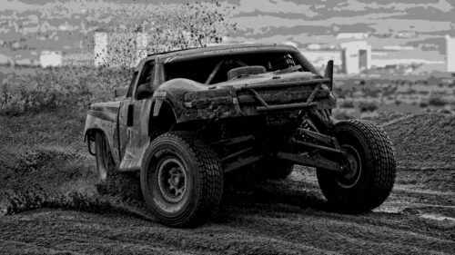 Rugged Off Road Trophy Truck in Action Desktop Wallpaper