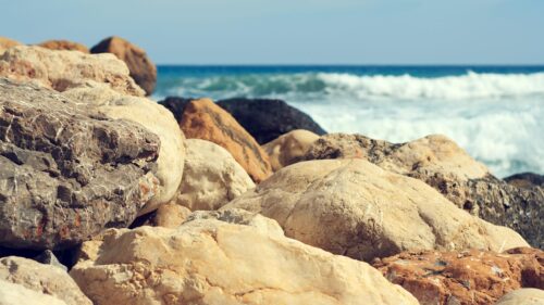 Rugged Coastal Rocks and Blue Ocean Waves Desktop Wallpaper