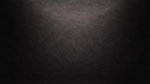 Elegant Black Leather Texture with Soft Spotlight Gradient PC Wallpaper