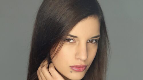 Stunning Portrait of a Brunette Woman with Piercing PC Wallpaper