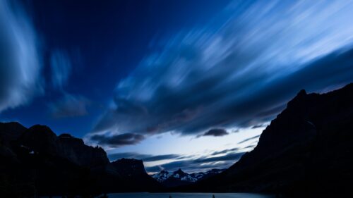 Stunning Night Sky Over Silhouetted Mountain Peaks 4K Desktop Wallpaper