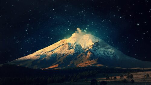 Majestic Snow Capped Volcano Under Starry Night Sky 4K Wallpaper