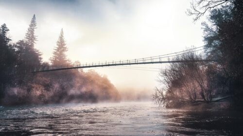 Misty River Suspension Bridge at Sunrise PC Wallpaper