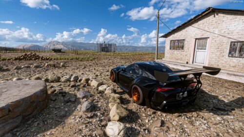 Modified Black Toyota Supra GR Sport Car in Rural Desert Landscape PC Wallpaper
