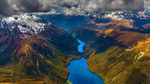 Breathtaking Aerial View of Alpine Lakes and Snow Capped Mountains PC Wallpaper