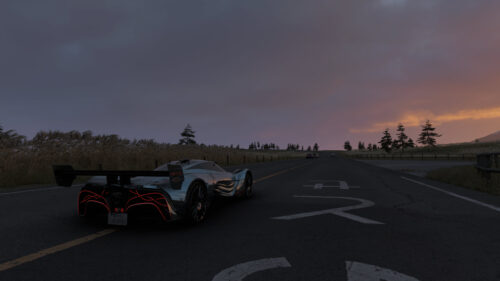 Aston Martin Valkyrie AMR Pro on Empty Country Road at Sunset 4K Wallpaper