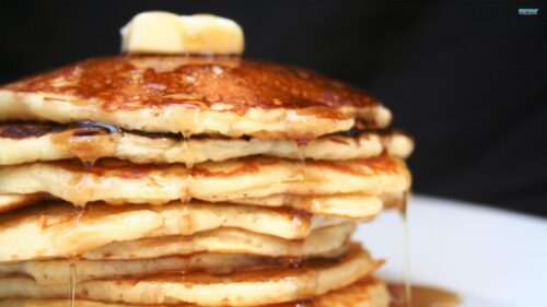 Delicious Stack of Golden Pancakes with Syrup and Butter Desktop Wallpaper