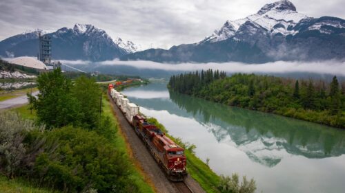 Canadian Pacific Freight Train Through Snowy Mountains Landscape PC Wallpaper