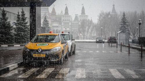 Yellow Taxi Cab in Snowy Moscow Streets Desktop Wallpaper