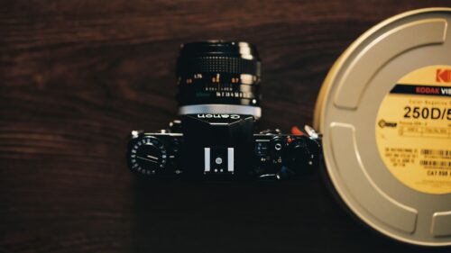 Vintage Canon Film Camera and Kodak Vision Film Reel Desktop Wallpaper