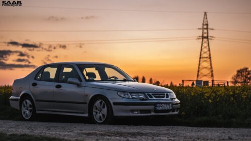 Silver Saab 9-5 Sedan at Golden Hour Sunset Desktop Wallpaper