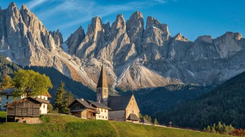 Breathtaking Dolomite Mountains with St Magdalena Church 4K Wallpaper
