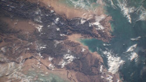 Breathtaking Earth Satellite View of Coastline and Mountain Terrain 4K Wallpaper