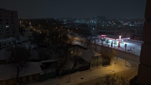 Night Cityscape Winter Snow Scene with Illuminated Gas Station PC Wallpaper