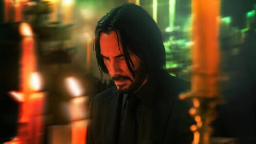 Keanu Reeves as John Wick in Atmospheric Candlelight 4K Wallpaper