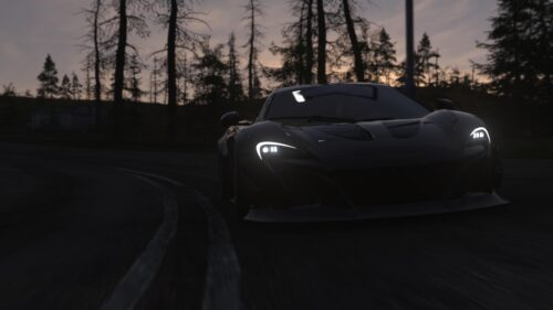 Black McLaren Sports Car Driving Through Twilight Forest PC Wallpaper