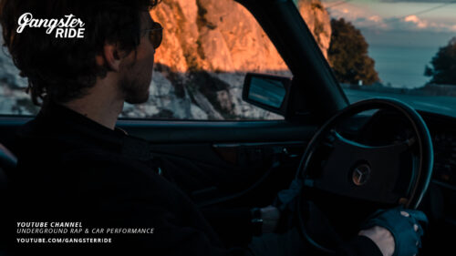 Man Driving Vintage Mercedes at Golden Hour Coastal Road 4K Wallpaper