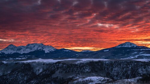 Fiery Red Sunset Over Snowy Mountain Peaks Desktop Wallpaper