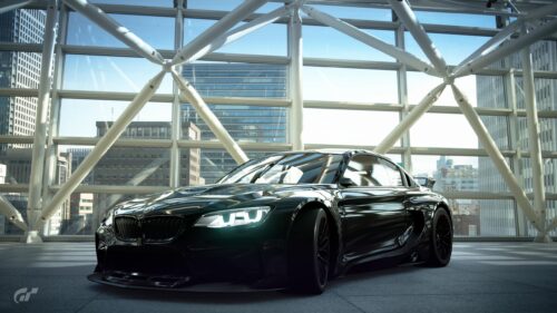 Black BMW M4 Sport Coupe in Modern Glass Architecture 4K Wallpaper