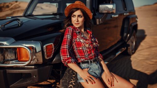 Beautiful Woman Posing with Black SUV in Desert PC Wallpaper