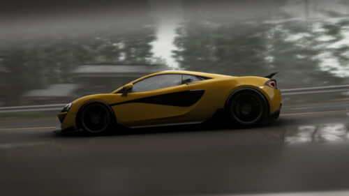 Yellow McLaren Supercar Speeding on Rainy Road Desktop Wallpaper