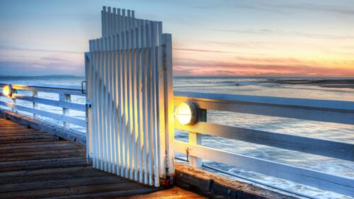 Stunning Wooden Pier Gate at Sunset Over the Ocean PC Wallpaper