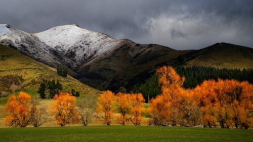 Dramatic Autumn Mountain Landscape with Snowy Peaks Desktop Wallpaper