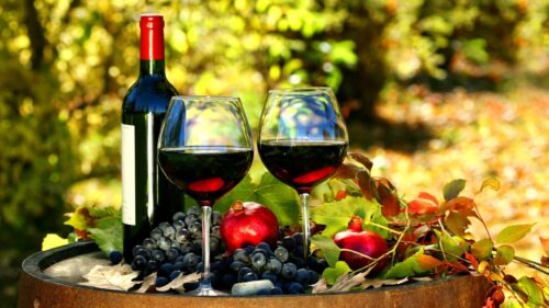 Elegant Red Wine and Pomegranate Still Life Desktop Wallpaper