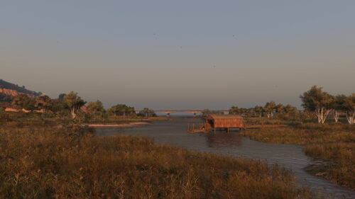 Serene River Landscape with Wooden Boathouse at Sunset PC Wallpaper