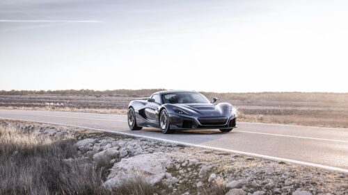 Rimac Nevera Electric Hypercar Driving on Scenic Desert Road PC Wallpaper