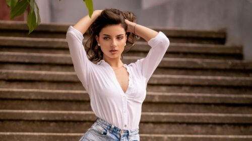 Beautiful Young Woman Posing on Outdoor Stairs Desktop Wallpaper