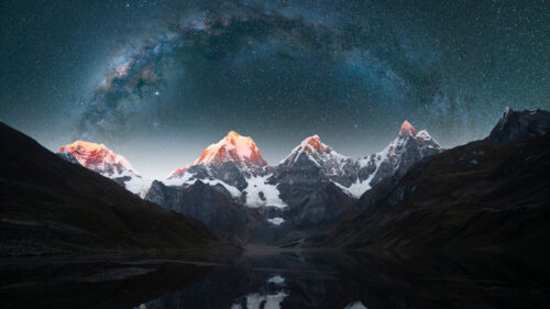 Majestic Snowy Peaks Under Milky Way Galaxy Desktop Wallpaper