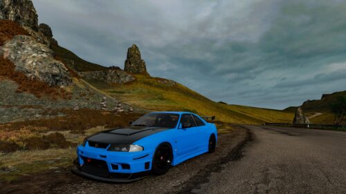 Blue Nissan Skyline GT-R R33 Sports Car on Highland Road PC Wallpaper