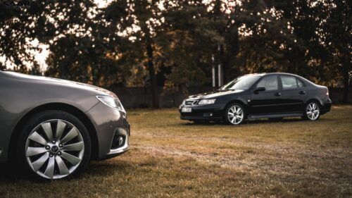 Stunning Saab Sedan Duo in Golden Hour Landscape PC Wallpaper