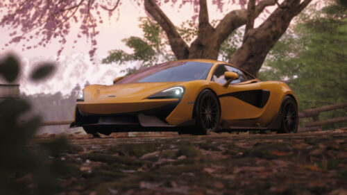 Stunning Yellow McLaren Sports Car Under Cherry Blossom Trees PC Wallpaper